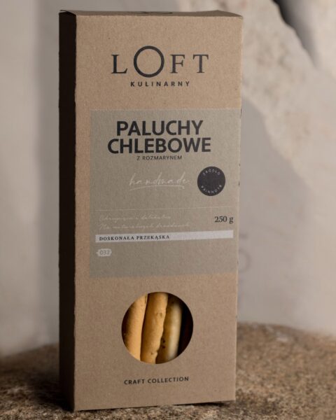 paluchy chlebowe z rozmarynem w szklance na loftowym tle